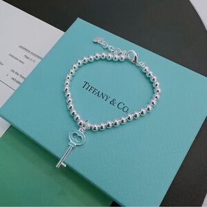 Tiffany & Co. Silver Bracelet with Key Charm